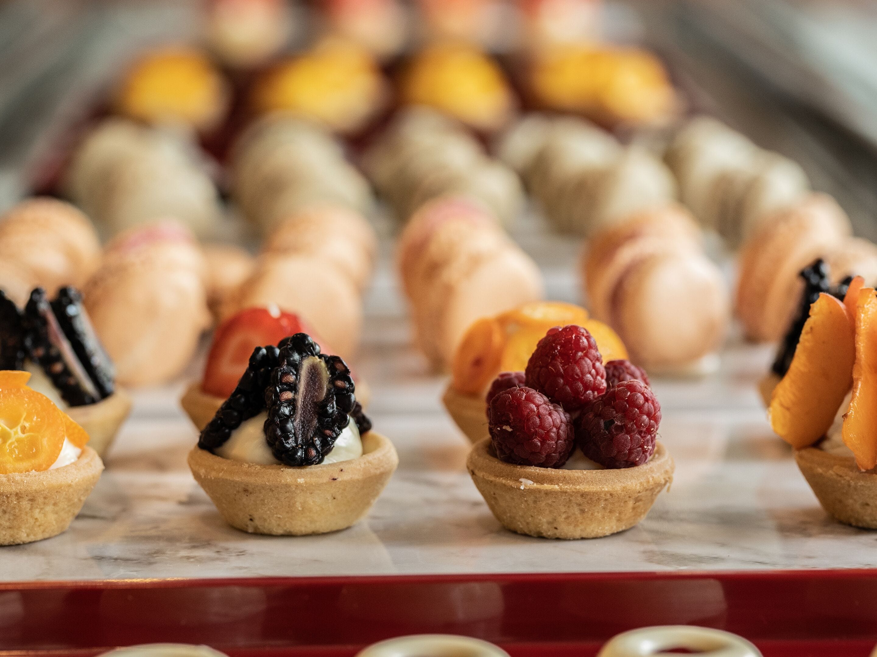 A variety of desserts arranged on a tray.
