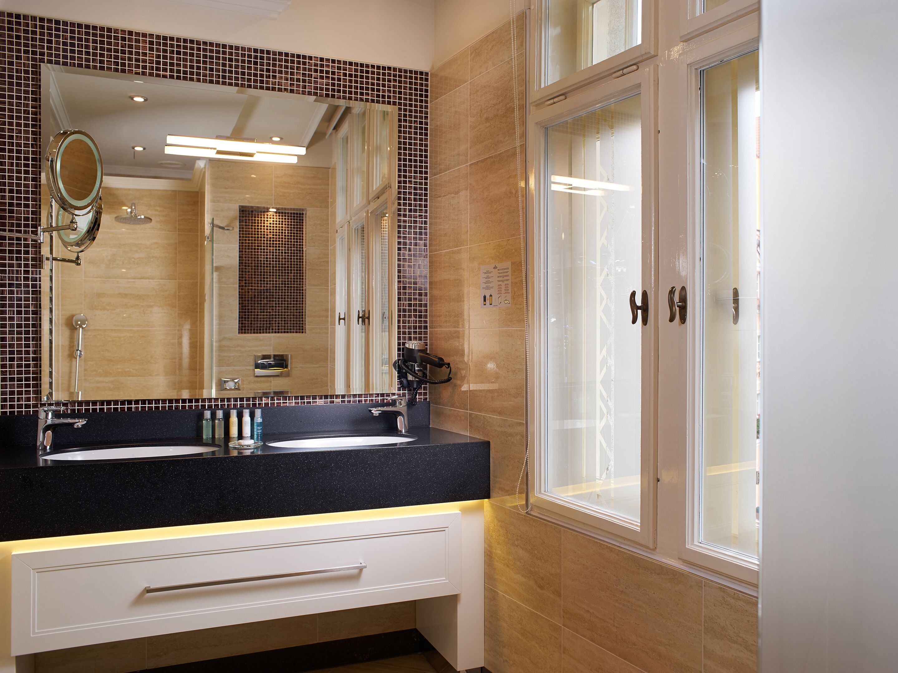 shower, hair dryer, slippers, towels