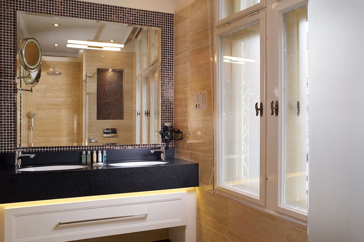 shower, hair dryer, slippers, towels