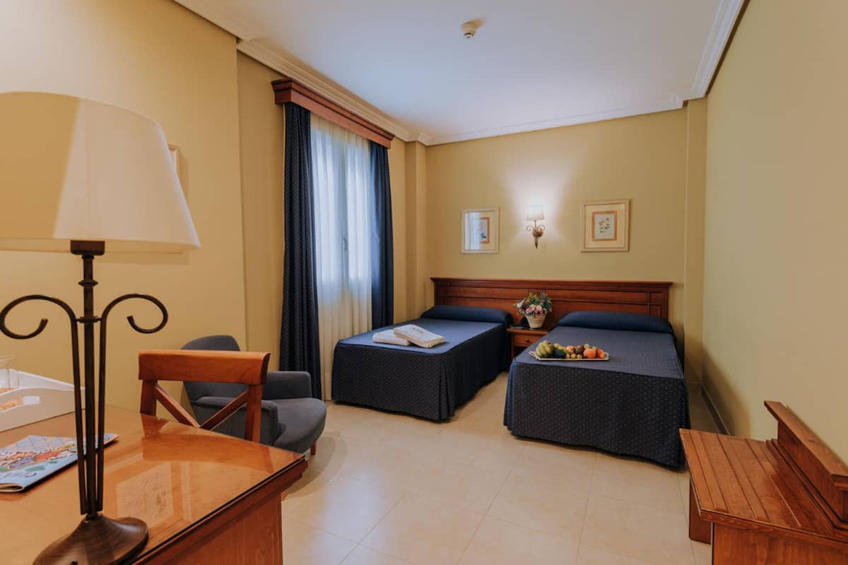 twin room | minibar, in-room safe, desk, laptop workspace