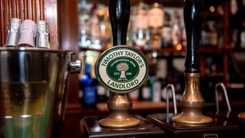 A tap labeled "Timothy Taylor's Champion Beers Landlord" with a brass handle and a green label.
