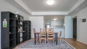 A modern kitchen with light-colored cabinets and a central island. - 3 Bedrooms 2 Car Parks Carlton Garden Opposite (Melbourne)