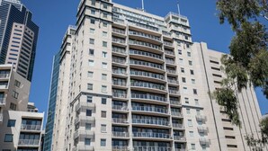 A multi-story building with balconies, large windows, and a clear sky. - 3 Bedrooms 2 Car Parks Carlton Garden Opposite (Melbourne)