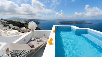 An infinity pool, a rooftop pool, pool umbrellas, sun loungers