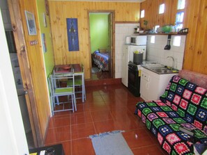 Economy Apartment, 1 Double Bed | Living area | Flat-screen TV - Cabañas Lilafken (Pichilemu)