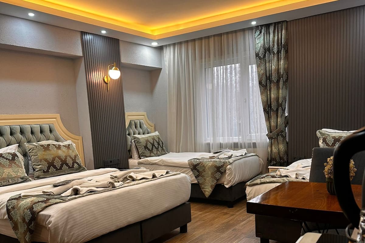 Habitación cuádruple familiar | 1 dormitorio, sábanas de algodón egipcio, ropa de cama de alta calidad