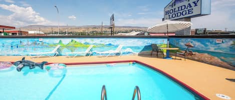 Seasonal outdoor pool, open 7:30 AM to 11:30 PM, pool umbrellas