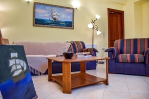 Apartment, 1 Bedroom | Living room | TV, fireplace - Captain's Seaside House (Zakynthos)