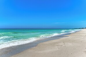 A beach with clear turquoise water and a sandy shore. - Unit #312 Sand Cay Beach Resort Pool View (Longboat Key)