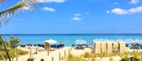 On the beach, sun-loungers, beach towels