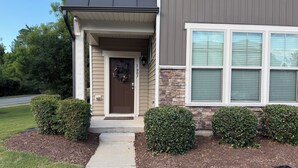 A residential house with a front porch, a mailbox, and a driveway. - 3 Spacious Bedroom-Executive Town House, <br>Brand-New Construction, Duke RTP (Durham)