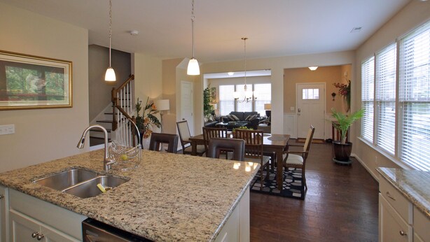 A spacious kitchen with granite countertops, stainless steel appliances, and pendant lighting. - 3 Spacious Bedroom-Executive Town House, <br>Brand-New Construction, Duke RTP (Durham)