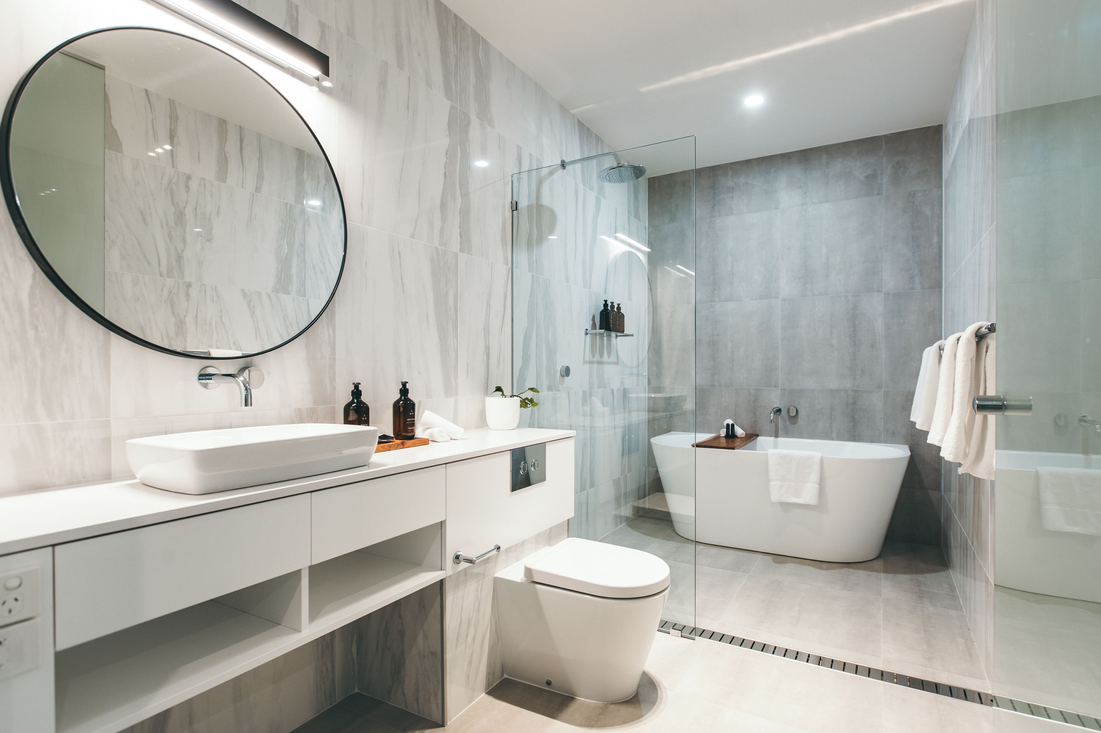 two bedroom pearce studio | bathroom | designer toiletries, hair dryer, bathrobes, slippers