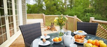 A delightful lodge with hot tub on Wakes Hall Farm is a haven of peace in 500 acres of private land