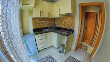 Mini-fridge, stovetop, griddle, cookware/dishes/utensils