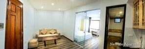 Apartamento, 1 quarto | Sala de estar | TV LCD 42 polegadas com canais a cabo, TV