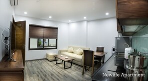 Apartamento, 1 habitación | Zona de estar | Televisión LCD de 42 pulgadas con canales por cable, una televisión