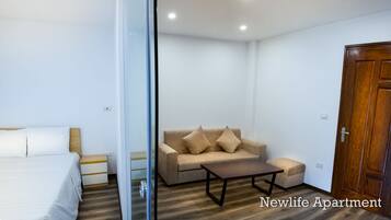Apartment, 1 Bedroom | Living area | 42-inch LCD TV with cable channels, TV