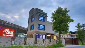 A modern two-story building with a flat roof and large windows. - Dania Garden (Luodong)