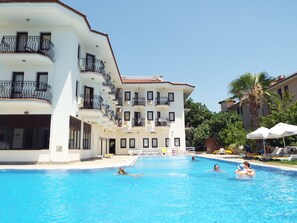 Outdoor pool, pool umbrellas, sun loungers