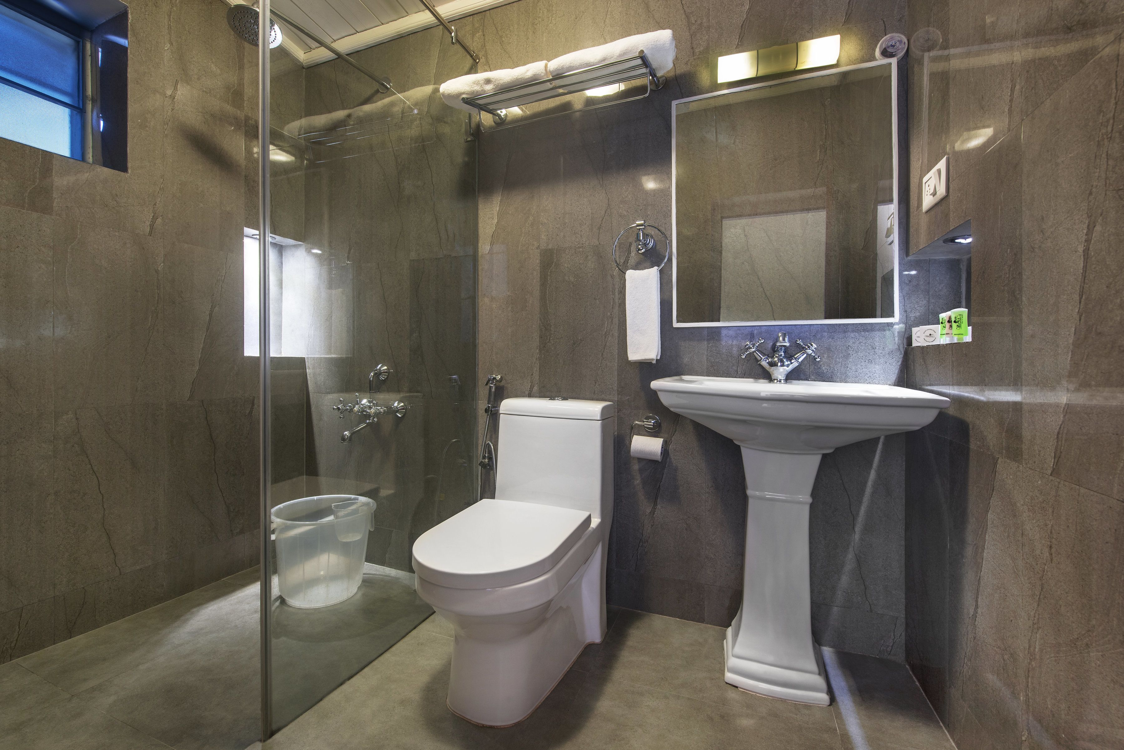signature suite with fireplace | bathroom | shower, free toiletries, slippers, towels