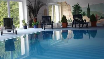Indoor pool, open 7 AM to 9 PM, sun loungers