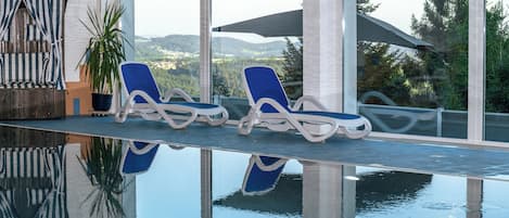 Indoor pool, open 7 AM to 9 PM, sun loungers