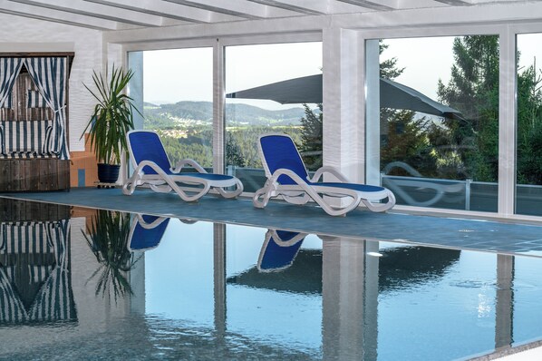 Indoor pool, open 7 AM to 9 PM, sun loungers