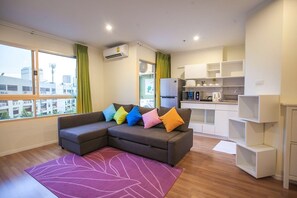 2-Bedroom Deluxe Apartment | Living room | 32-inch flat-screen TV with cable channels, TV - Nicely Apartment Close RCA Nightclub (Bangkok)