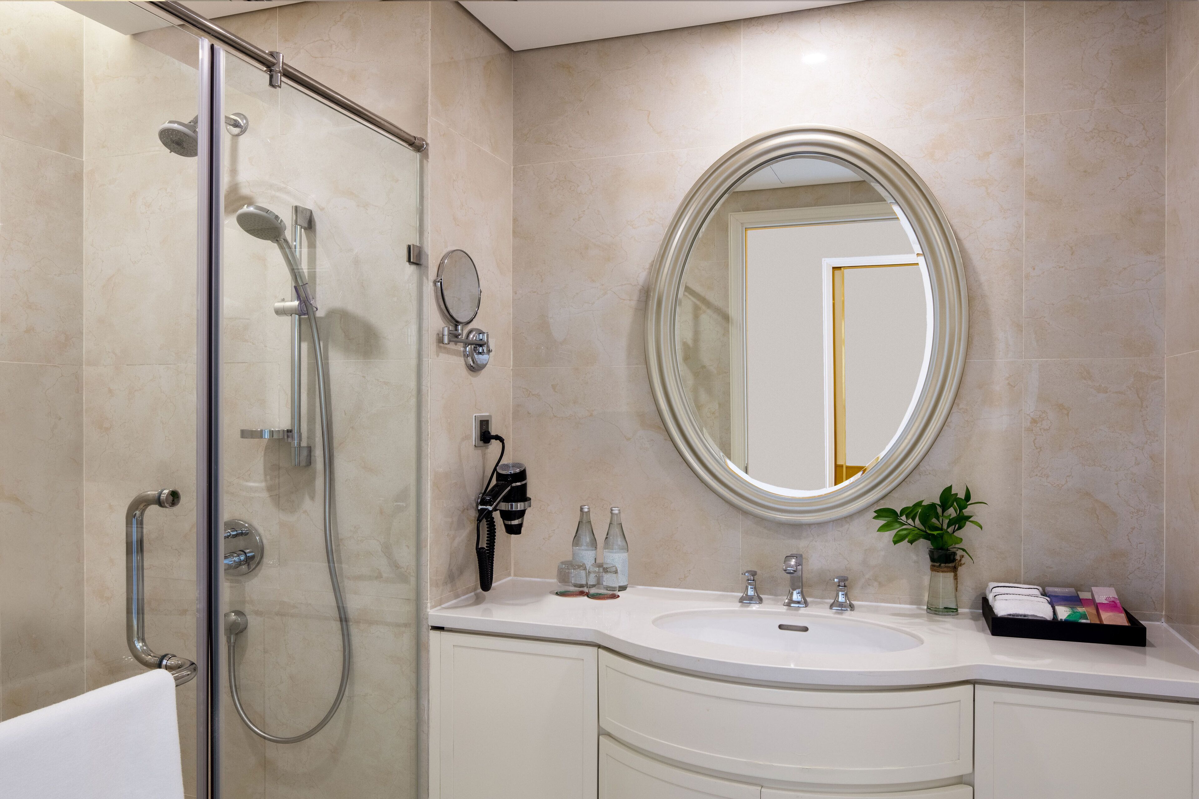 designer toiletries, hair dryer, bathrobes, slippers