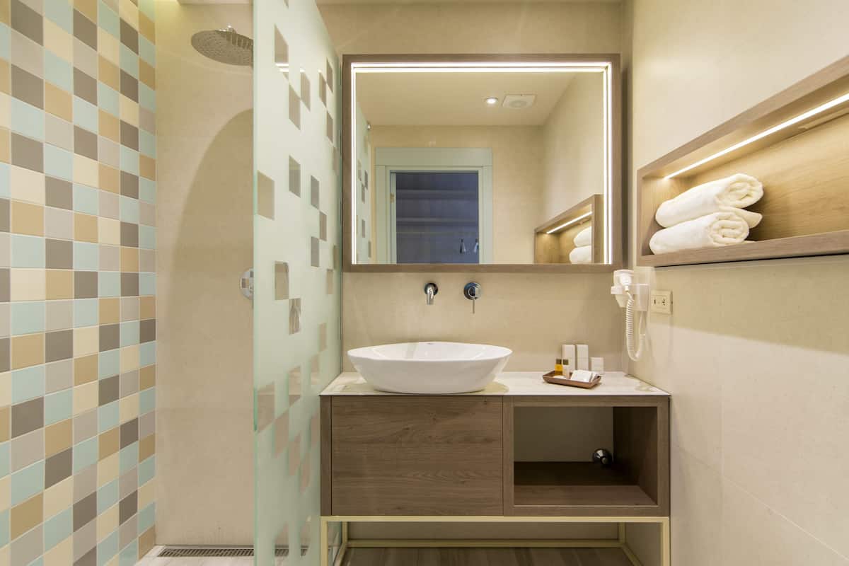 economy double or twin room, 1 queen bed | bathroom | shower, free toiletries, hair dryer, slippers