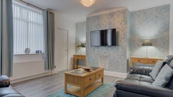 32-inch flat-screen TV with cable channels, TV