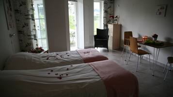 Deluxe Condo, 1 Bedroom, Accessible, Garden View | 1 bedroom, desk, soundproofing, iron/ironing board