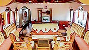 A room with a sofa set, a small table, and a television. - GuestHouser 3 BHK Houseboat e567 (Kuttanad Taluk)