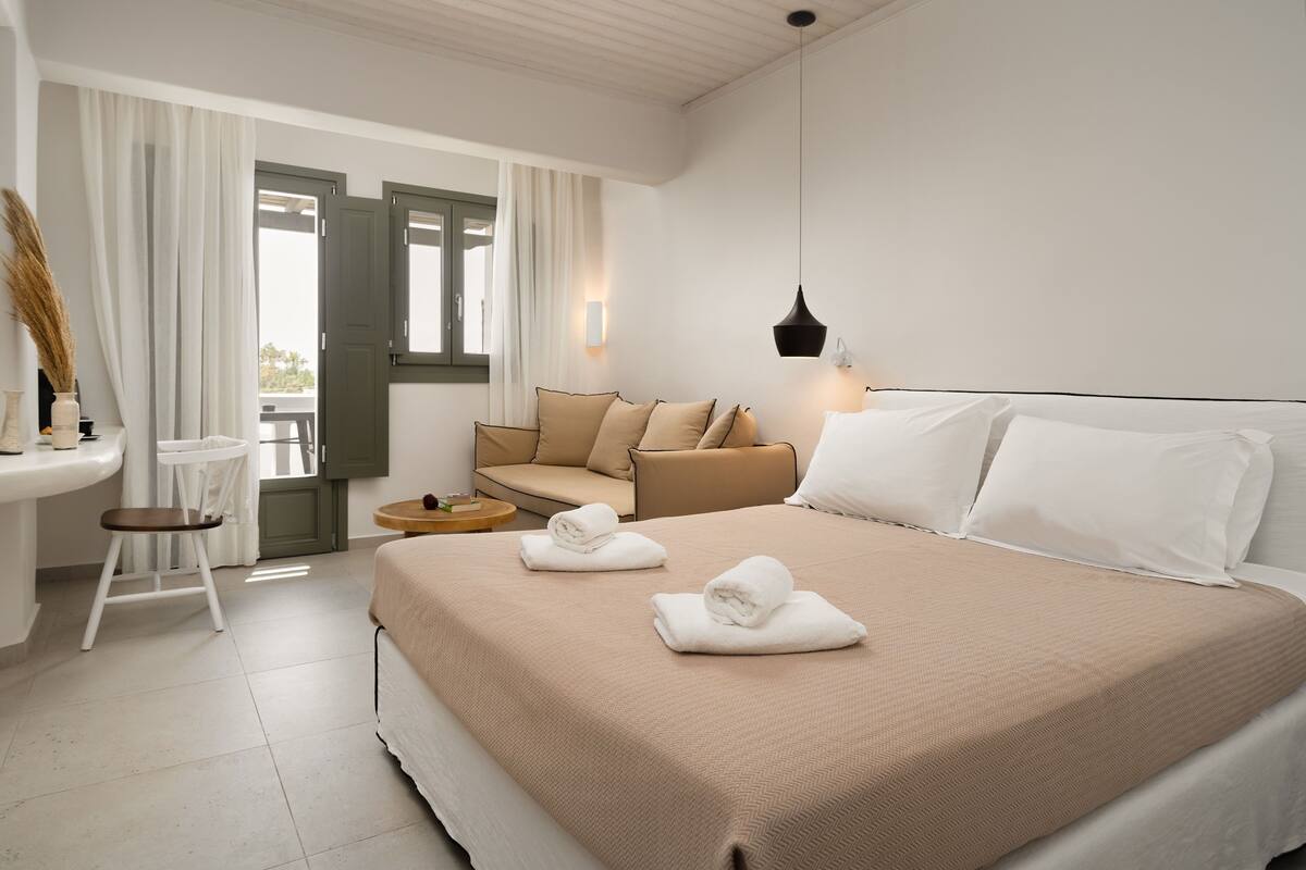 triple room, sea view | 2 bedrooms, premium bedding, minibar, in-room safe