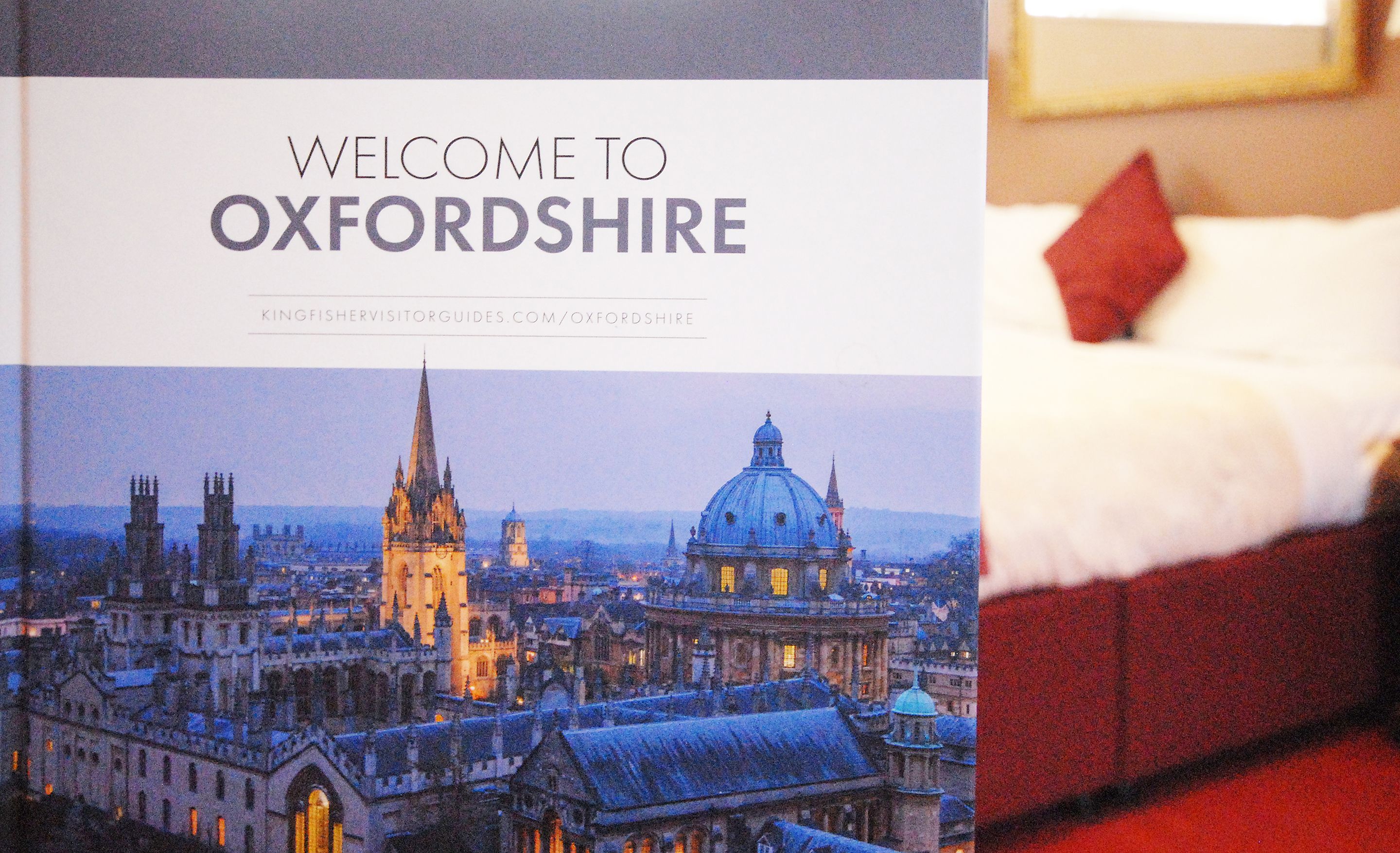 A book cover titled "Welcome to Oxfordshire" with a cityscape illustration.