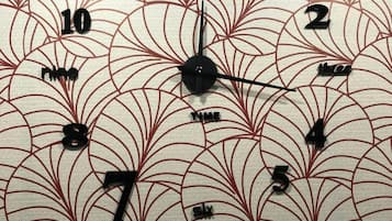 A wall clock with a floral pattern.