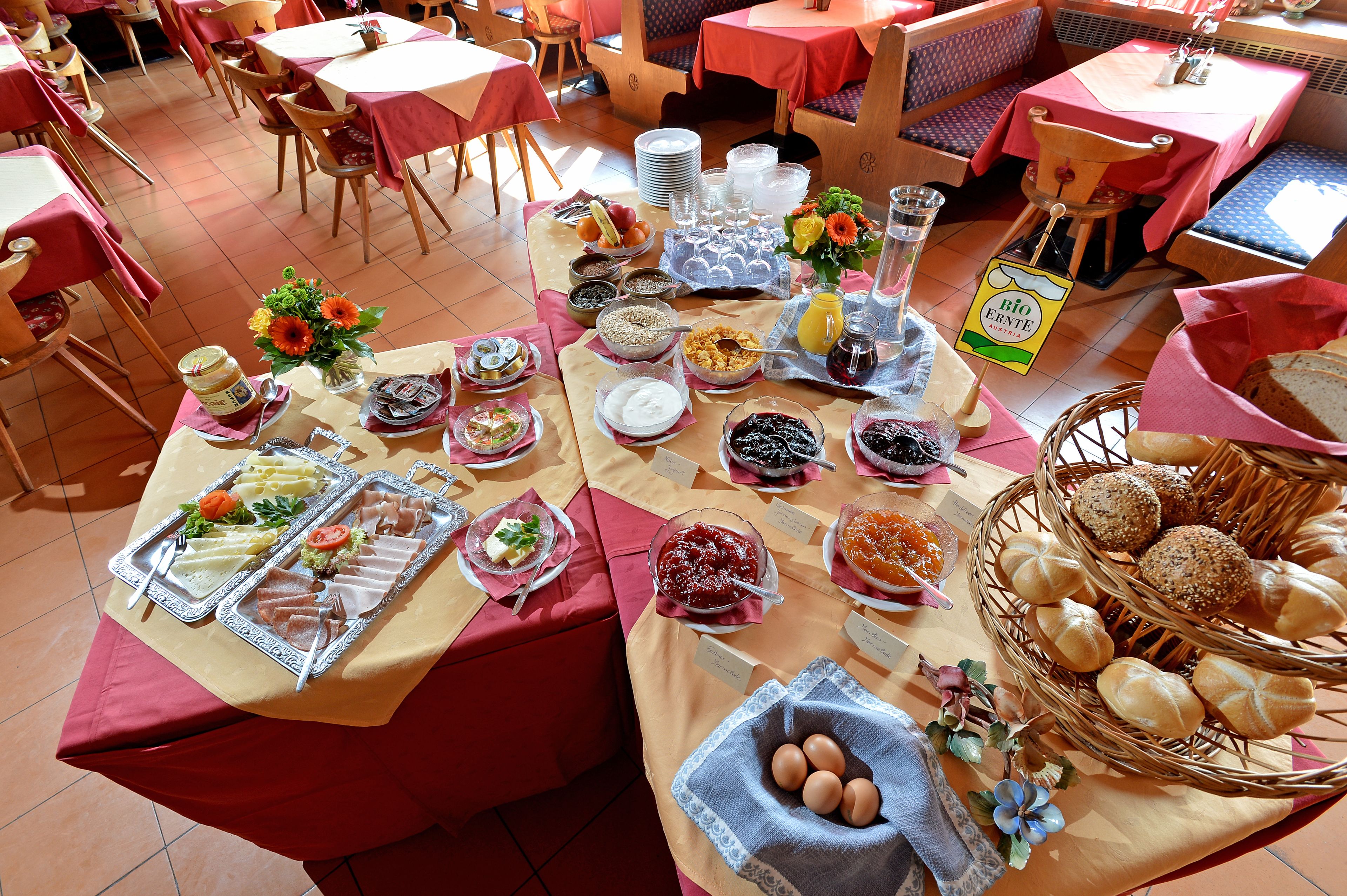 A buffet setup with various food items and beverages.