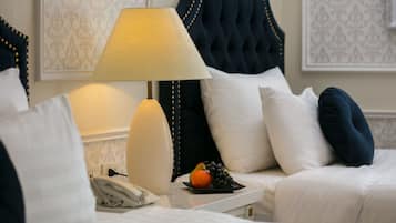 Deluxe Triple Room, Courtyard View | Premium bedding, minibar, in-room safe, desk