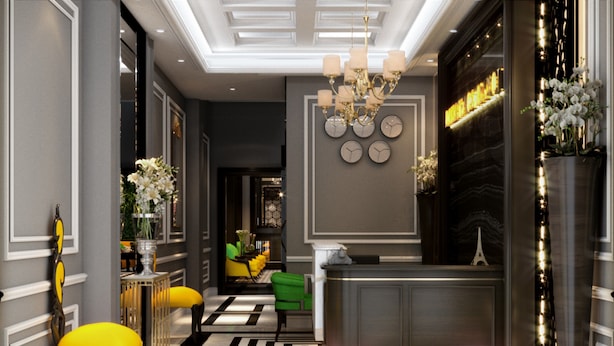 A modern lobby with a reception desk, a chandelier, and a black and white striped floor. - Flora Centre Hotel & Spa (Hanoi)