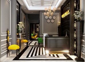 A modern lobby with a reception desk, a chandelier, and a black and white striped floor. - Flora Centre Hotel & Spa (Hanoi)