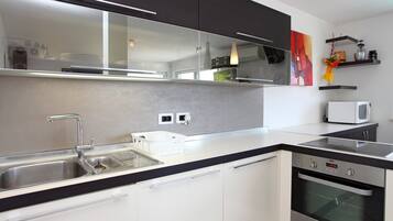 Apartment, 2 Bedrooms, Sea View | Private kitchen | Fridge, oven, stovetop, dishwasher