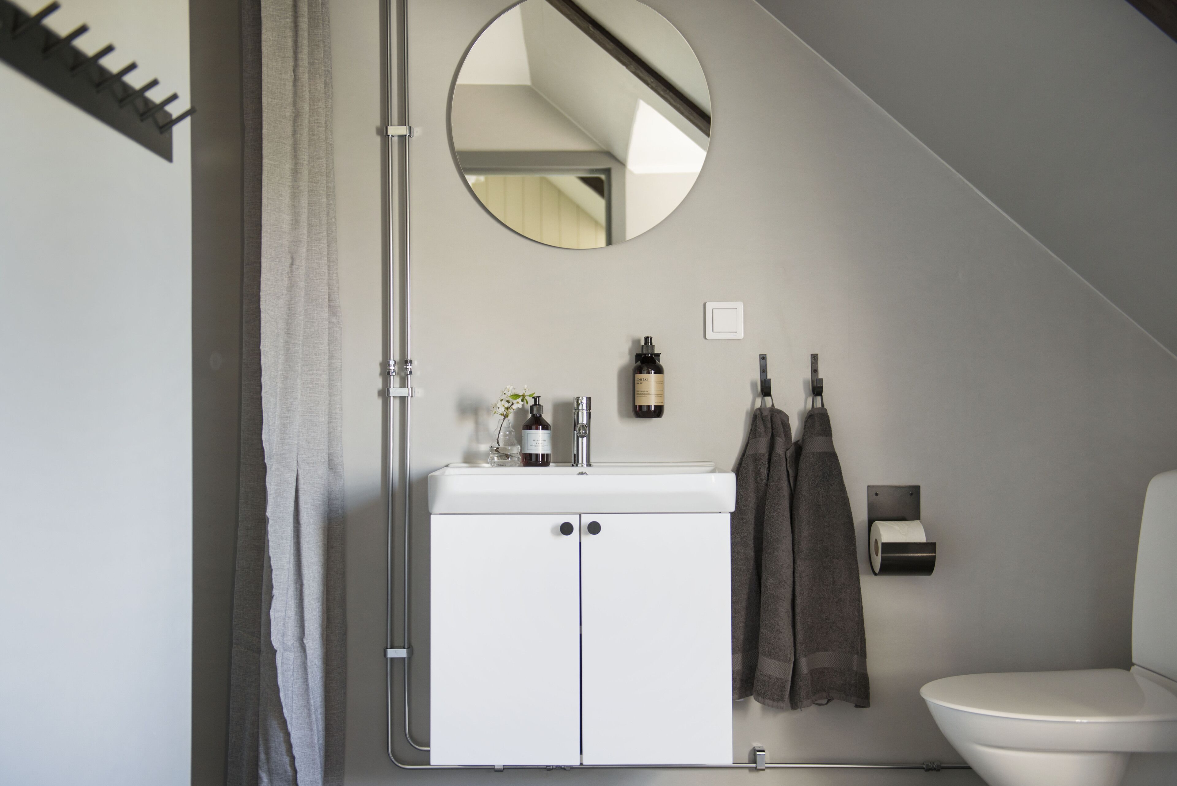 designer toiletries, hair dryer, towels