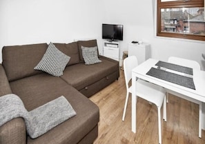 Desk, laptop workspace, blackout curtains, iron/ironing board