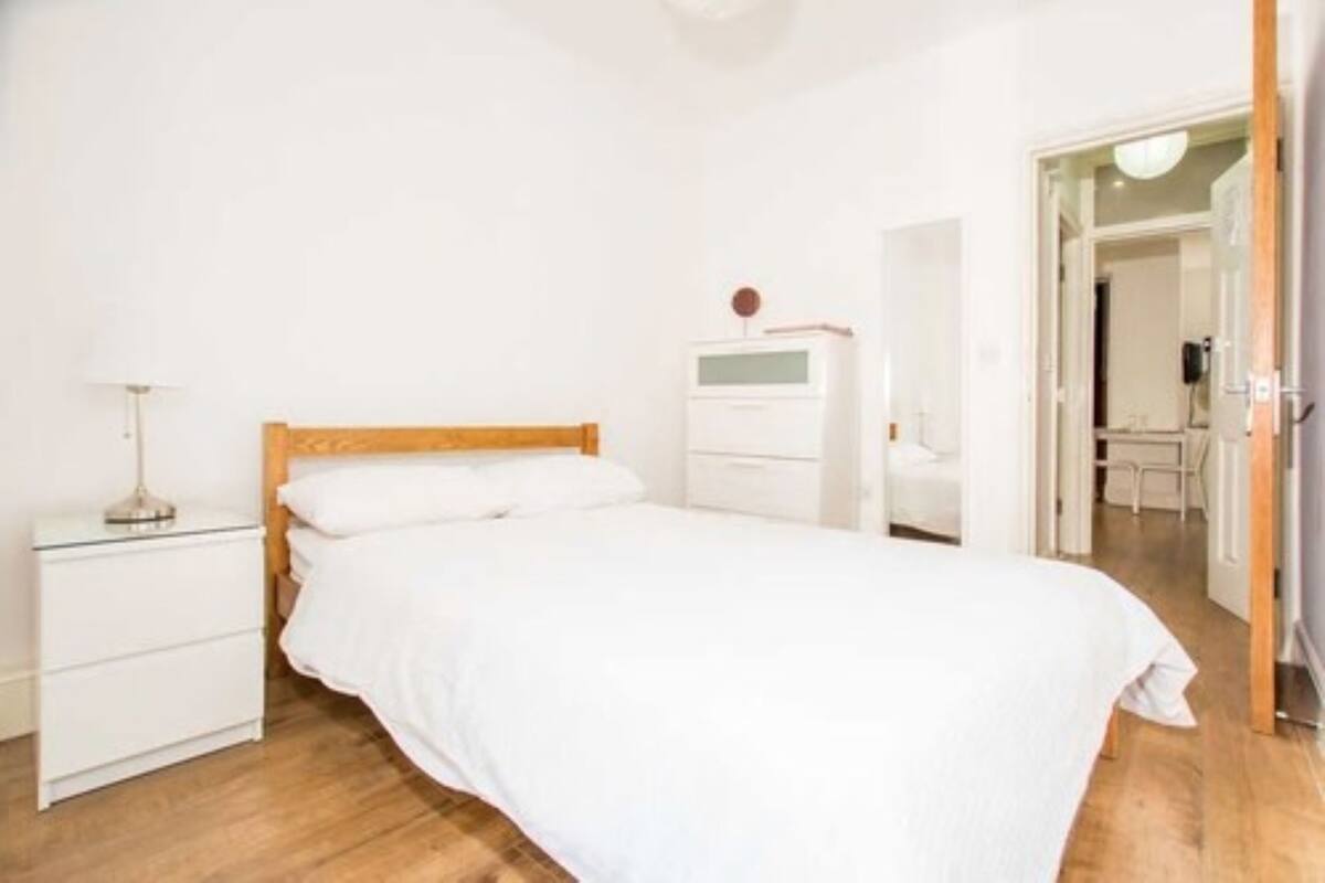 Desk, laptop workspace, blackout curtains, iron/ironing board