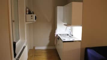 Fridge, microwave, stovetop, dining tables