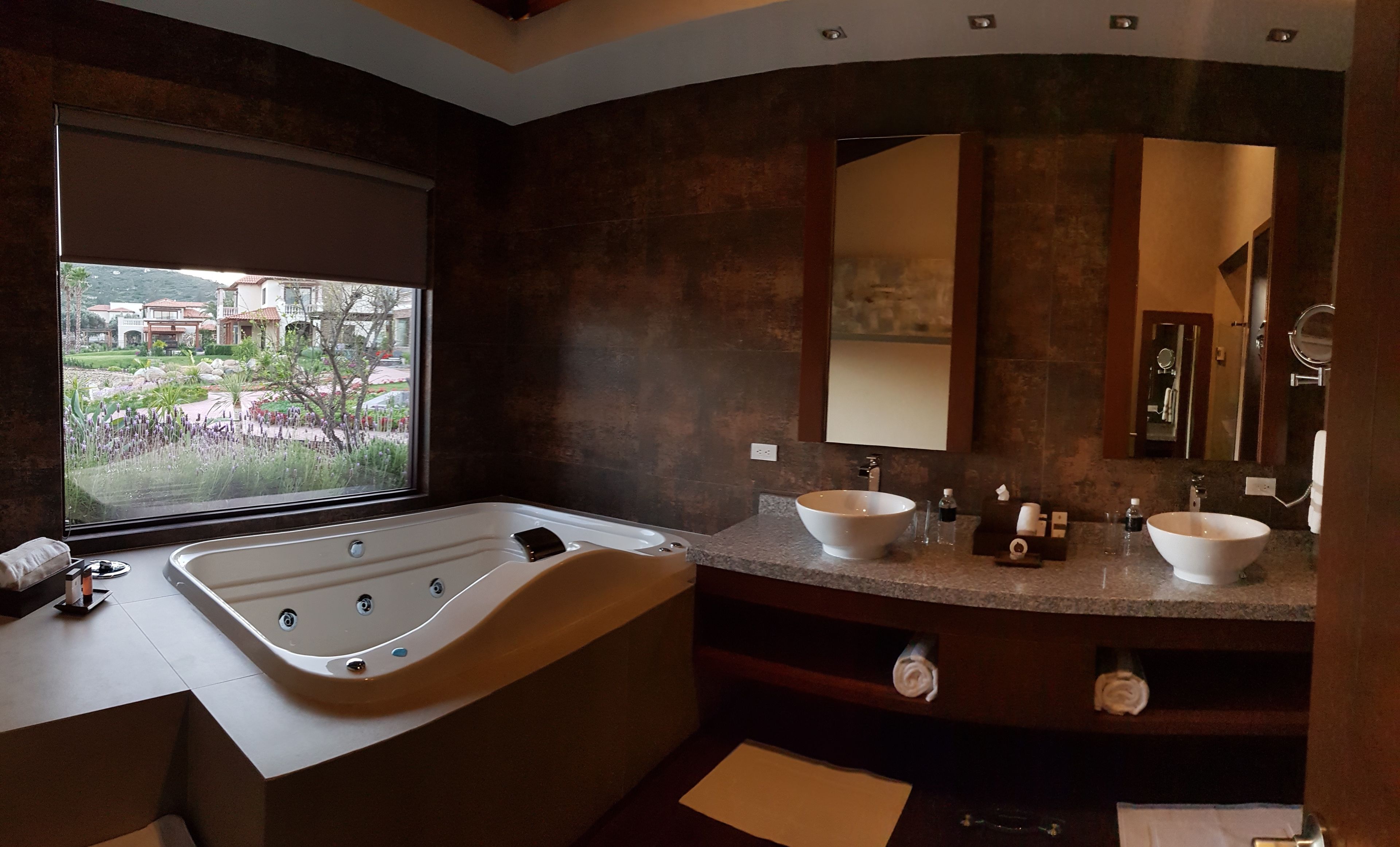 master suite | bathroom | shower, rainfall showerhead, designer toiletries, hair dryer