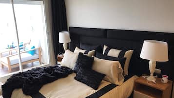Luxury Apartment, Beach View | 1 bedroom, down comforters, blackout drapes, iron/ironing board