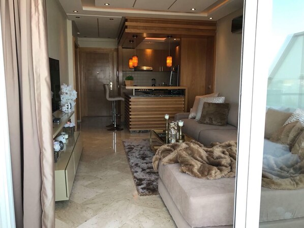 Luxury Apartment, Beach View | Living room | 55-inch flat-screen TV with satellite channels, TV, DVD player - Peninsula dar bouaza (Dar Bouazza)