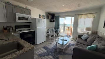 Condo, 1 Bedroom | Living area | Flat-screen TV